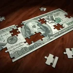 Nota de dólar em quebra cabeça. Foto: Pixabay